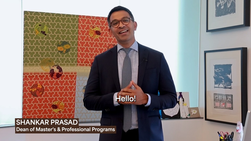 Dean Shankar Prasad smiles and says 'hello' to master's students.